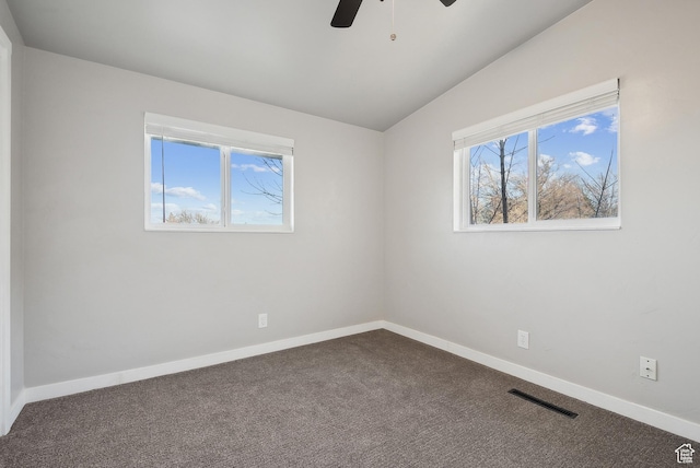 118 N Iowa Ave, Ogden, UT 84404 - unfurnished room with visible vents, baseboards, lofted ceiling, a ceiling fan, and dark colored carpet