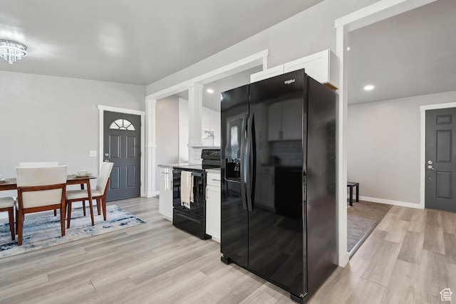 118 N Iowa Ave, Ogden, UT 84404 - kitchen featuring light wood-type flooring, baseboards, black appliances, and white cabinetry