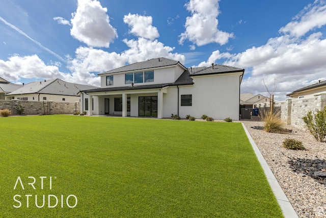 3823 S Kennedy Ln, Washington, UT 84780 - rear view of property featuring stucco siding, a patio, a lawn, and a fenced backyard
