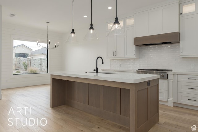 3823 S Kennedy Ln, Washington, UT 84780 - kitchen featuring visible vents, a sink, white cabinetry, wall chimney range hood, and light wood-type flooring