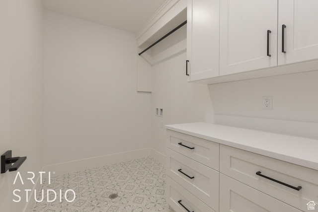 3823 S Kennedy Ln, Washington, UT 84780 - clothes washing area featuring hookup for a washing machine, cabinet space, baseboards, and tile patterned floors
