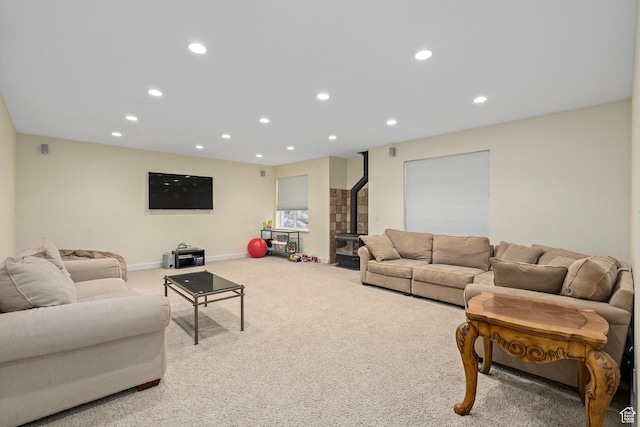 5798 W 11350 N, Highland, UT 84003 - living room with carpet floors, a wood stove, recessed lighting, and baseboards