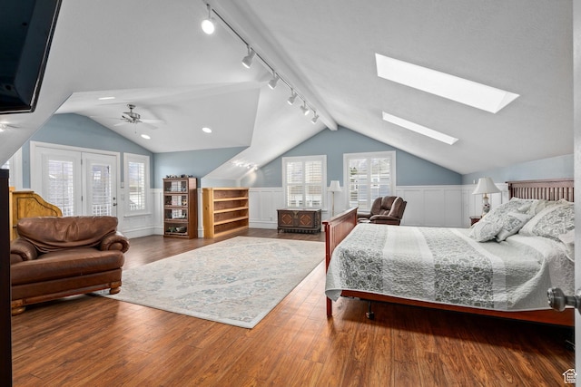 5798 W 11350 N, Highland, UT 84003 - bedroom with ceiling fan, rail lighting, wood finished floors, access to exterior, and lofted ceiling with skylight