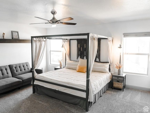 bedroom featuring baseboards, a ceiling fan, and carpet floors