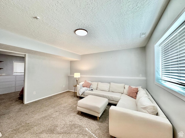 2964 W 5775 S, Roy, UT 84067 - living room featuring carpet flooring, a textured ceiling, visible vents, and plenty of natural light