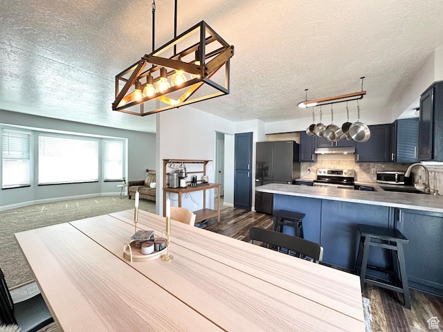 2964 W 5775 S, Roy, UT 84067 - dining area with baseboards, a textured ceiling, and dark wood-style floors