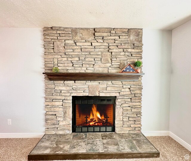 2964 W 5775 S, Roy, UT 84067 - room details featuring carpet flooring, a textured ceiling, baseboards, and a stone fireplace