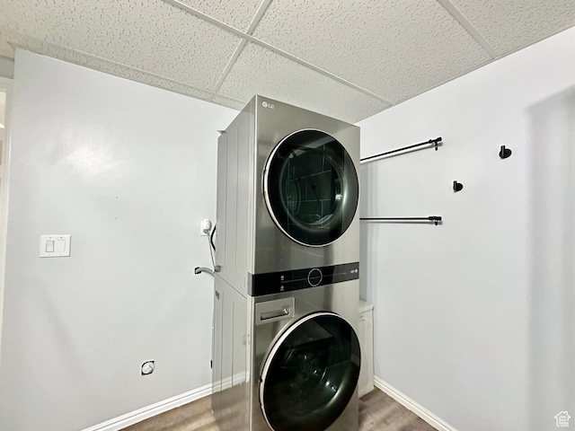 2964 W 5775 S, Roy, UT 84067 - clothes washing area featuring baseboards, laundry area, and stacked washer and dryer