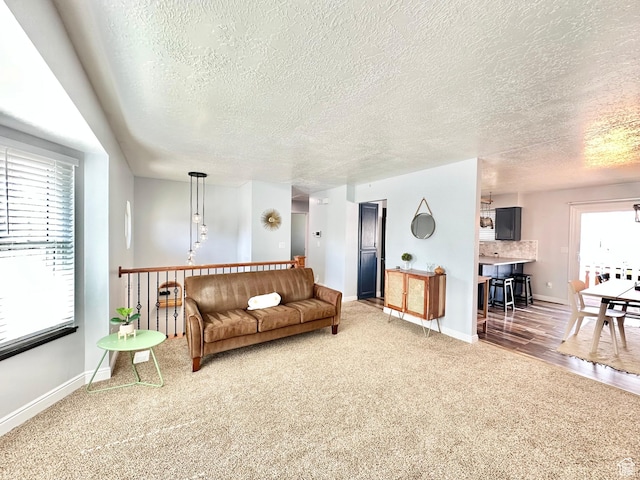 2964 W 5775 S, Roy, UT 84067 - living area featuring a textured ceiling, light carpet, and baseboards
