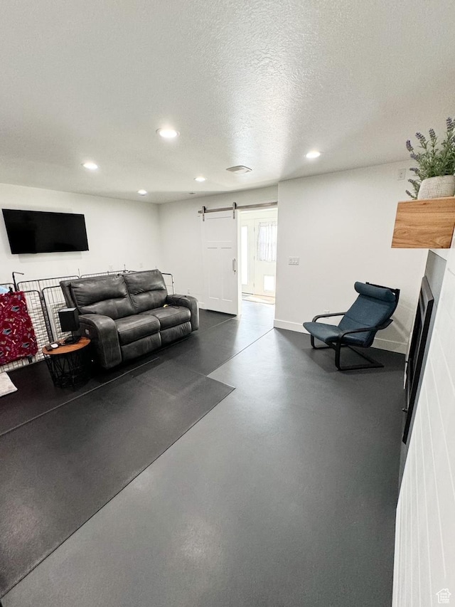 5517 S 6800 W, Hooper, UT 84315 - living room with recessed lighting, a barn door, a textured ceiling, and finished concrete flooring