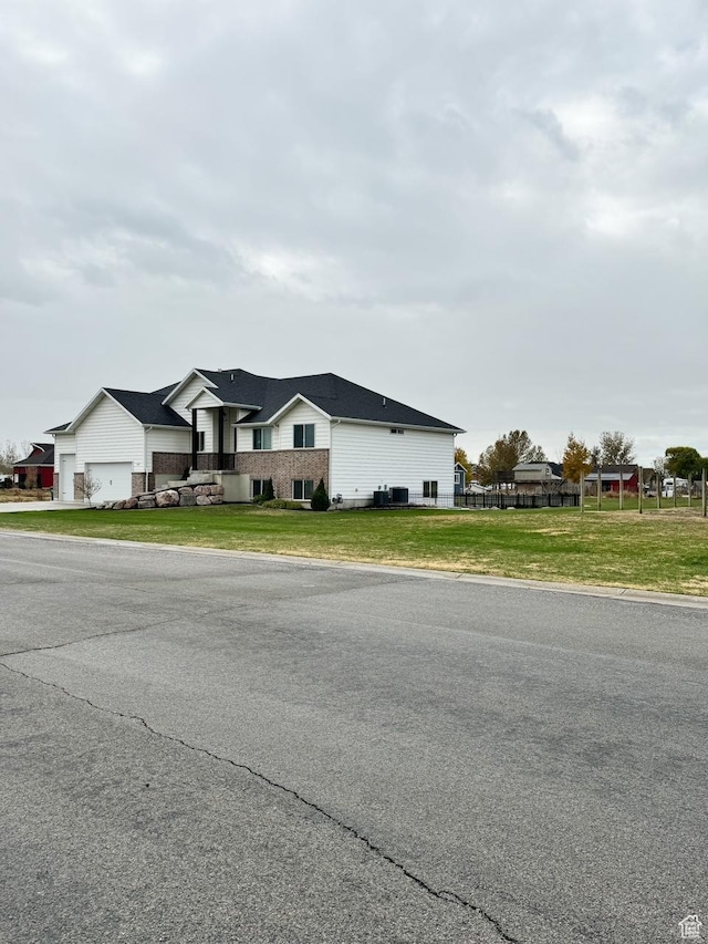 5517 S 6800 W, Hooper, UT 84315 - view of front of home featuring brick siding and a front lawn