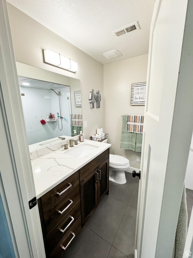 5517 S 6800 W, Hooper, UT 84315 - bathroom featuring vanity, visible vents, tile patterned flooring, a textured ceiling, and toilet