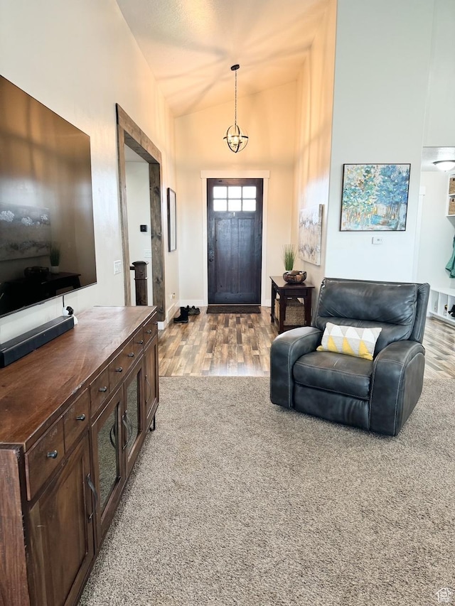 5517 S 6800 W, Hooper, UT 84315 - carpeted foyer entrance with baseboards, high vaulted ceiling, and wood finished floors