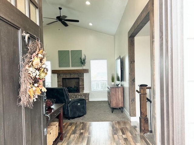5517 S 6800 W, Hooper, UT 84315 - living area with wood finished floors, baseboards, high vaulted ceiling, ceiling fan, and a brick fireplace