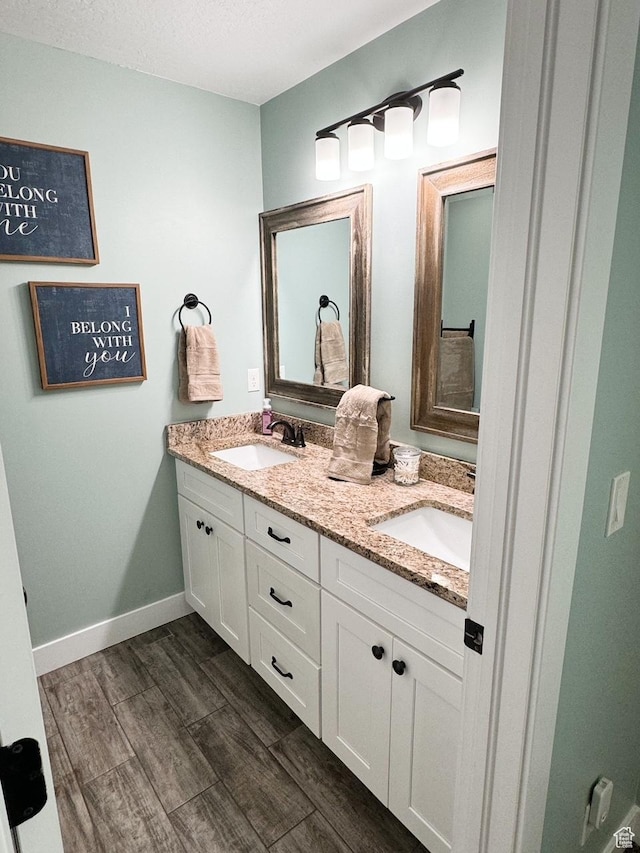 5517 S 6800 W, Hooper, UT 84315 - bathroom with a sink, baseboards, wood finished floors, and double vanity