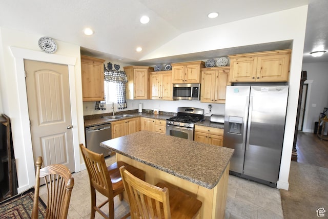 342 S 1250 E, Hyrum, UT 84319 - kitchen with stainless steel appliances, a sink, lofted ceiling, dark countertops, and a center island