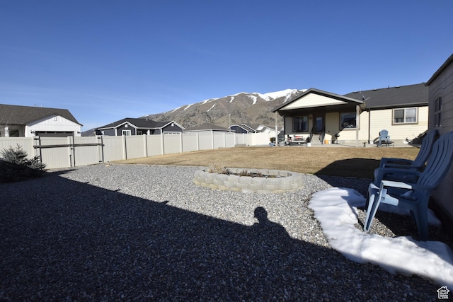 342 S 1250 E, Hyrum, UT 84319 - view of yard with a mountain view, a gate, and a patio area