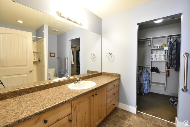 342 S 1250 E, Hyrum, UT 84319 - full bath with vanity, a spacious closet, toilet, and baseboards