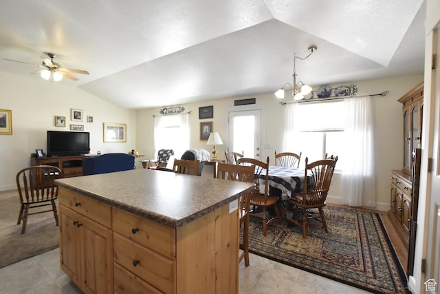 342 S 1250 E, Hyrum, UT 84319 - kitchen with lofted ceiling, a center island, light brown cabinetry, ceiling fan, and a chandelier