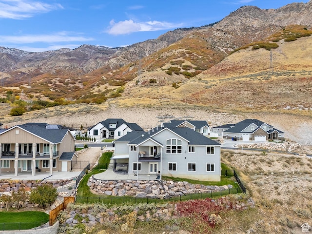 birds eye view of property featuring a mountain view and a residential view