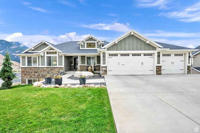 view of front facade featuring stone siding, board and batten siding, and a garage
