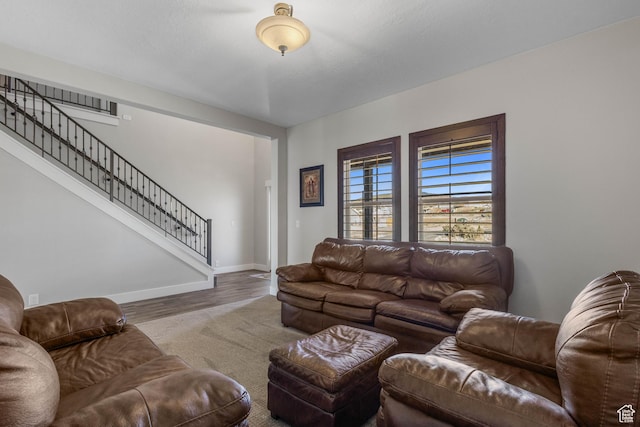 2409 W Rim Rock Dr, Stockton, UT 84071 - living room featuring stairway, baseboards, and wood finished floors