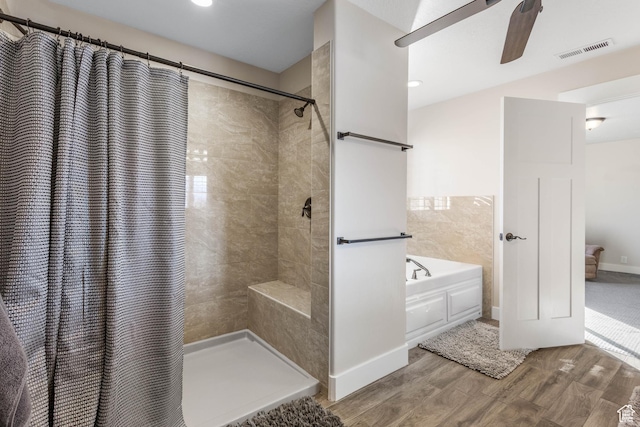 2409 W Rim Rock Dr, Stockton, UT 84071 - full bath with a bath, visible vents, tiled shower, and wood finished floors