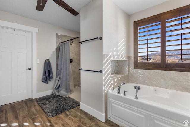 2409 W Rim Rock Dr, Stockton, UT 84071 - bathroom featuring baseboards, a shower with shower curtain, a garden tub, and wood finished floors
