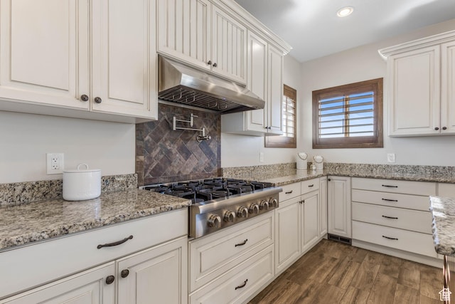 2409 W Rim Rock Dr, Stockton, UT 84071 - kitchen with under cabinet range hood, white cabinetry, dark wood-type flooring, and stainless steel gas cooktop