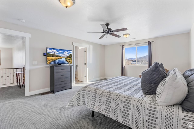 2409 W Rim Rock Dr, Stockton, UT 84071 - bedroom with baseboards, light carpet, and ceiling fan