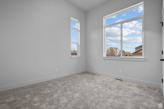 6317 W Cape Ridge Ln, West Valley City, UT 84128 - carpeted empty room featuring visible vents and baseboards