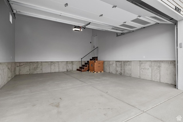 6317 W Cape Ridge Ln, West Valley City, UT 84128 - garage featuring a garage door opener