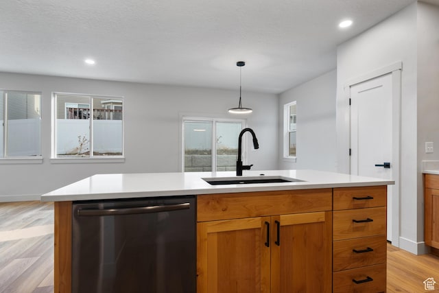 6317 W Cape Ridge Ln, West Valley City, UT 84128 - kitchen with light wood finished floors, dishwasher, light countertops, and a sink
