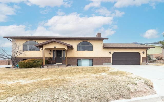 161 S Canyon Rd E, Parowan, UT 84761 - raised ranch with brick siding, stucco siding, a chimney, a garage, and driveway
