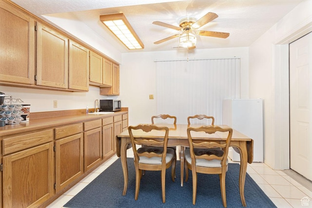 161 S Canyon Rd E, Parowan, UT 84761 - dining room with light tile patterned flooring and ceiling fan