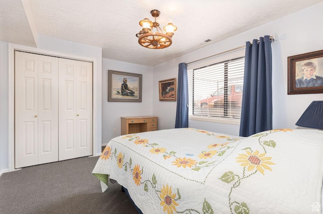 161 S Canyon Rd E, Parowan, UT 84761 - bedroom with a closet, carpet flooring, a textured ceiling, and a notable chandelier