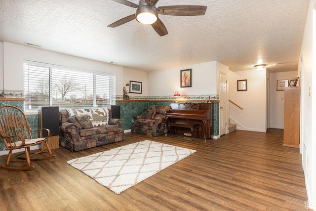 161 S Canyon Rd E, Parowan, UT 84761 - living room featuring stairway, baseboards, a textured ceiling, and wood finished floors
