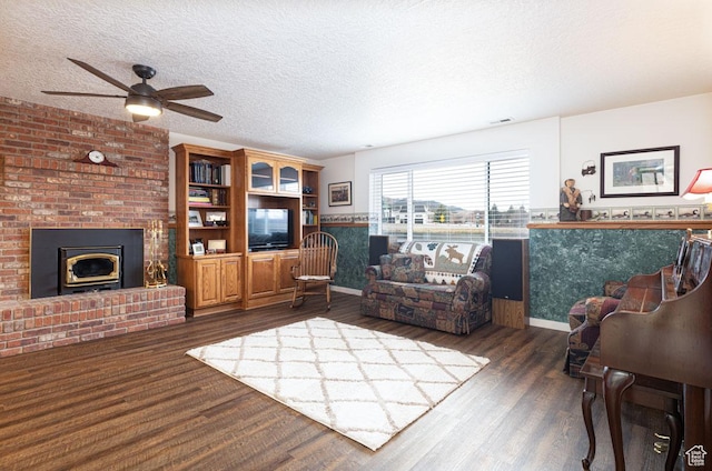 161 S Canyon Rd E, Parowan, UT 84761 - living area featuring visible vents, a textured ceiling, wood finished floors, and a fireplace