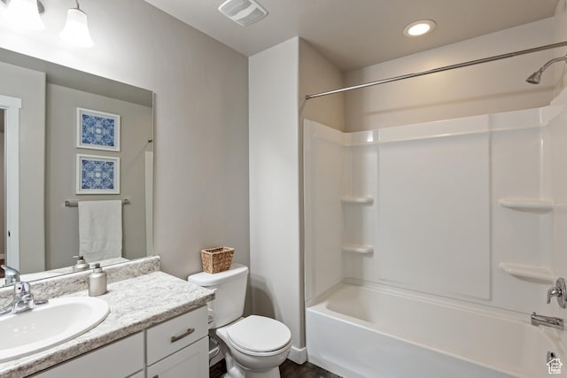 full bathroom featuring visible vents, shower / tub combination, toilet, and vanity