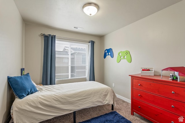 bedroom with carpet flooring, baseboards, and visible vents