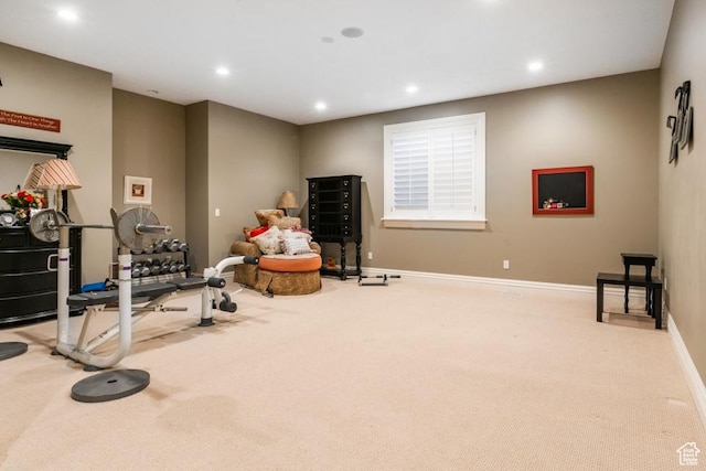 exercise area featuring recessed lighting, baseboards, and carpet floors