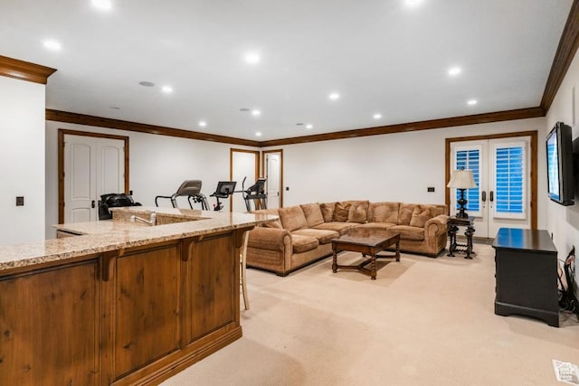 living area featuring light carpet, recessed lighting, french doors, and crown molding
