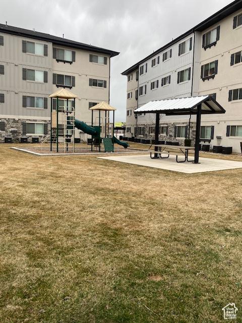 1700 S Sandhill Unit H203, Orem, UT 84058 - surrounding community featuring a gazebo, a lawn, and playground community