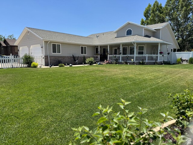 2922 S 500 E, Vernal, UT 84078 - rear view of house featuring an attached garage, a shingled roof, brick siding, and a porch