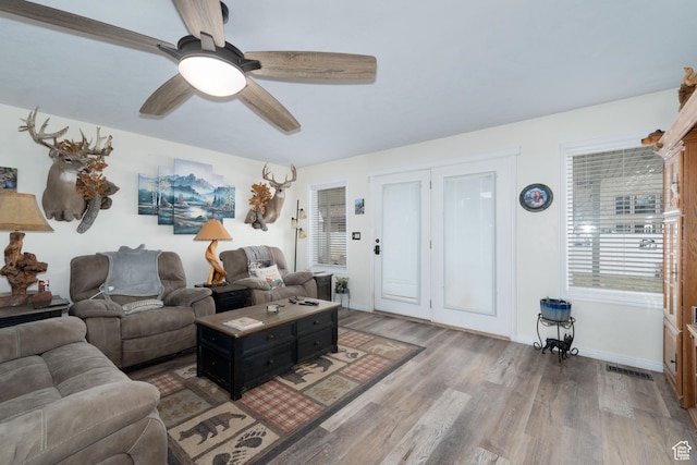 2922 S 500 E, Vernal, UT 84078 - living room with wood finished floors, a ceiling fan, and baseboards