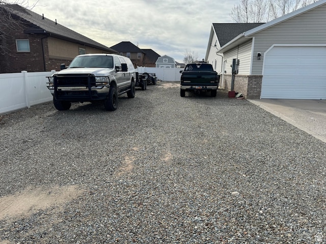 2922 S 500 E, Vernal, UT 84078 - view of side of home featuring brick siding, fence, a residential view, and roof with shingles