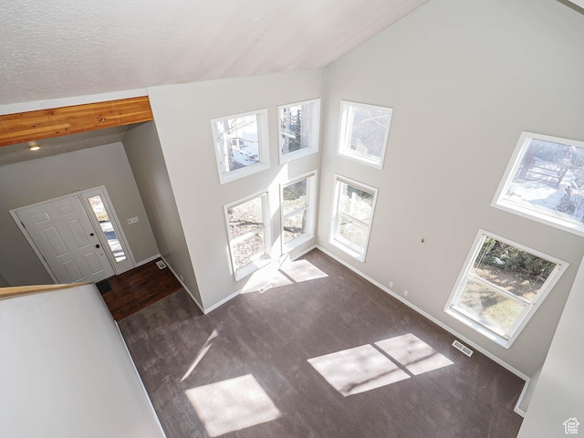 8004 Mustang Loop Rd, Park City, UT 84098 - carpeted foyer with baseboards, visible vents, and high vaulted ceiling