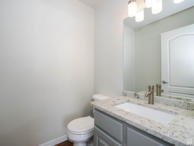 8004 Mustang Loop Rd, Park City, UT 84098 - half bathroom featuring toilet, vanity, and baseboards