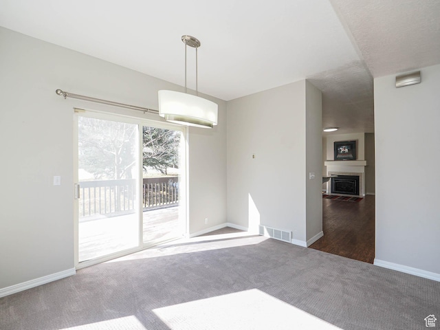 8004 Mustang Loop Rd, Park City, UT 84098 - unfurnished dining area featuring visible vents, a fireplace, carpet, and baseboards