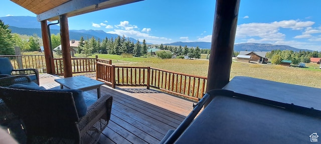 5085 Trumpeter, Island Park, ID 83429 - deck featuring a mountain view and a lawn